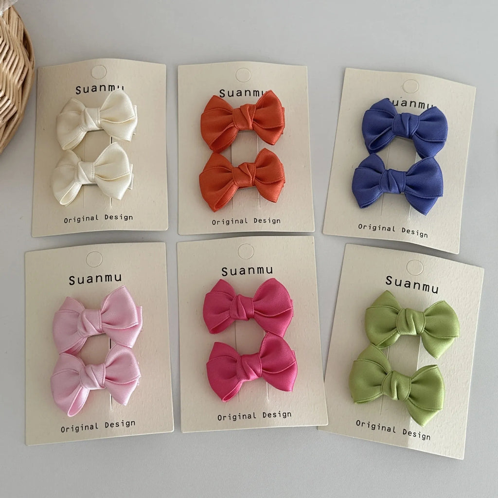 Fabric bowknot children's hair clip in cream colour with 6cm bow size on side clip