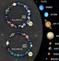 Two adjustable natural stone beaded bracelets with zodiac charms on a wooden surface.