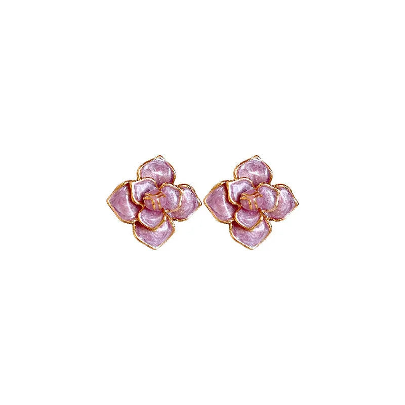 Golden-purple oil-spot glaze flower stud earrings on a copper base with surgical steel posts.