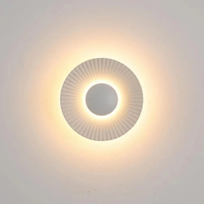 Round aluminium wall lamp with LED light in a choice of six colour finishes.
