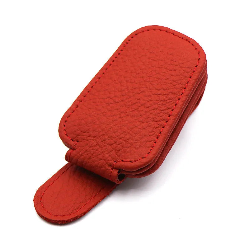 PU leather car sunglasses clip holder mounted on a grey sun visor.