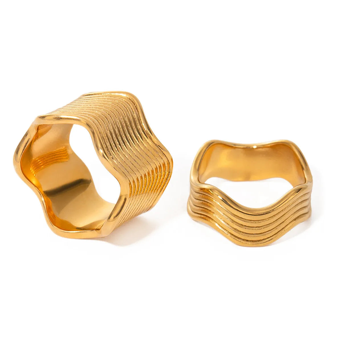 Stainless steel wide band ring with geometric wave pattern and polished electroplated finish