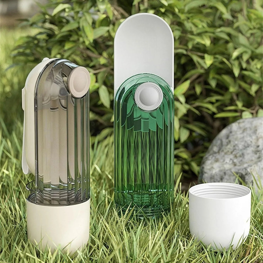 Beige foldable dog water bottle and food dispenser with large drinking opening, shown next to a leash.