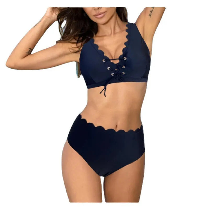 Red high-waisted women's two-piece swimsuit with a gathering split detail on a mannequin.