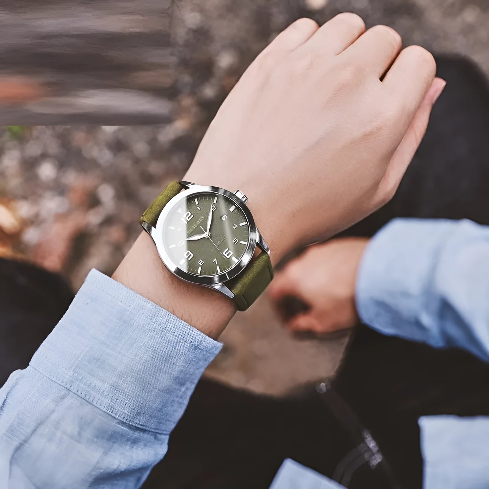 Men's automatic mechanical watch with leather strap on wrist, showing business casual retro style.