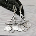 Retro creative leaves hollow step pendant earrings in silver alloy with irregular leaf shape for women's fashion