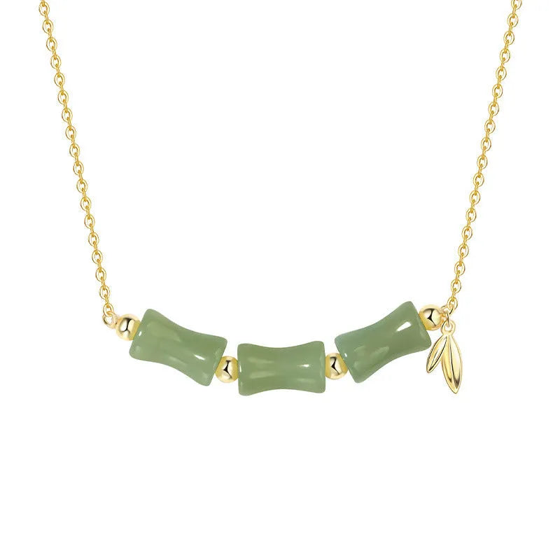 Chinese bamboo design jade bracelet and necklace set with green jade accents on alloy framework