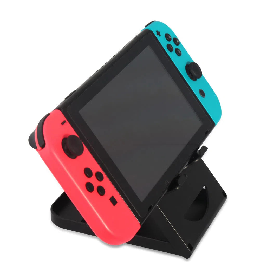 Black adjustable ABS game console stand for Switch on a desktop surface