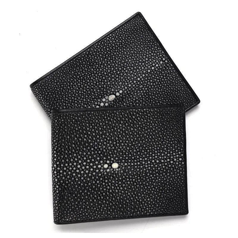 Genuine leather pearl fishskin wallet in horizontal square shape on a plain background