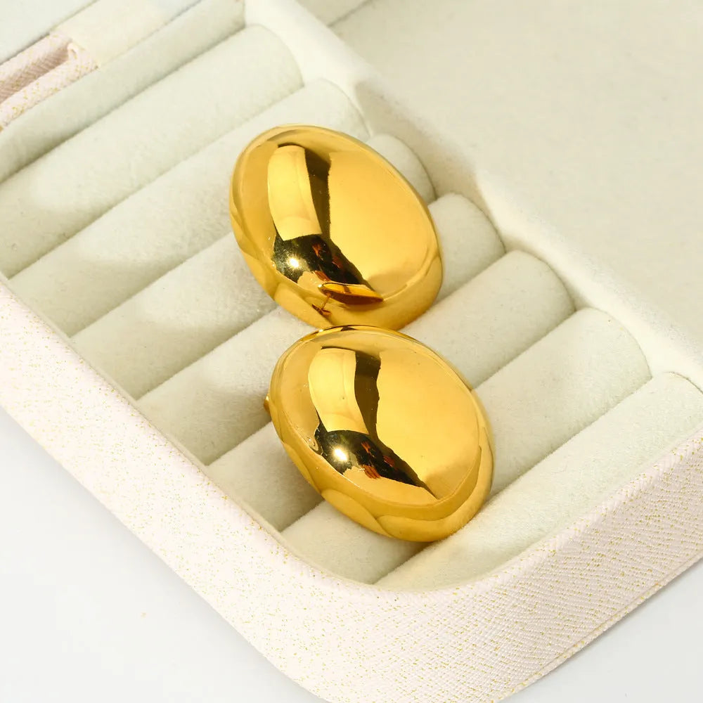 Geometric stainless steel ear studs with a glazed electroplated finish in colour DFE139.