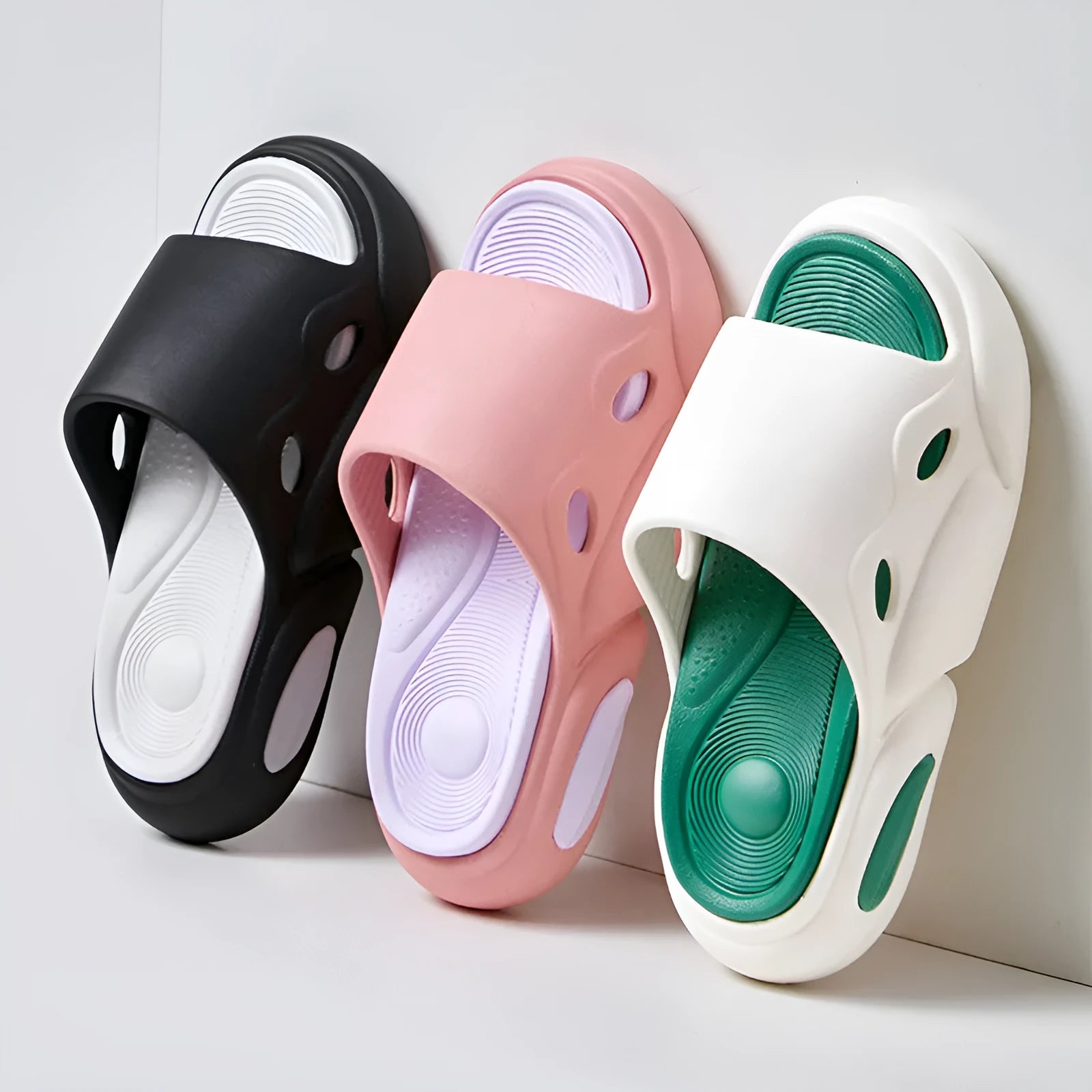 Women's two-colour slippers with thick EVA soles and leather lining in pink purple, white green, and black white.