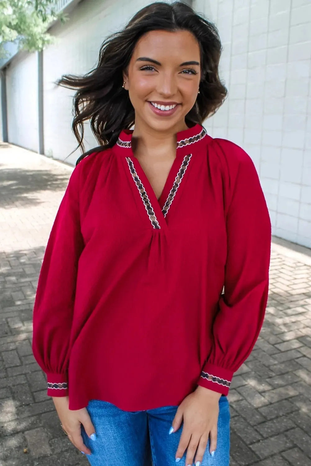 Women's red loose fit polyester pullover shirt with embroidered collar and printed detail