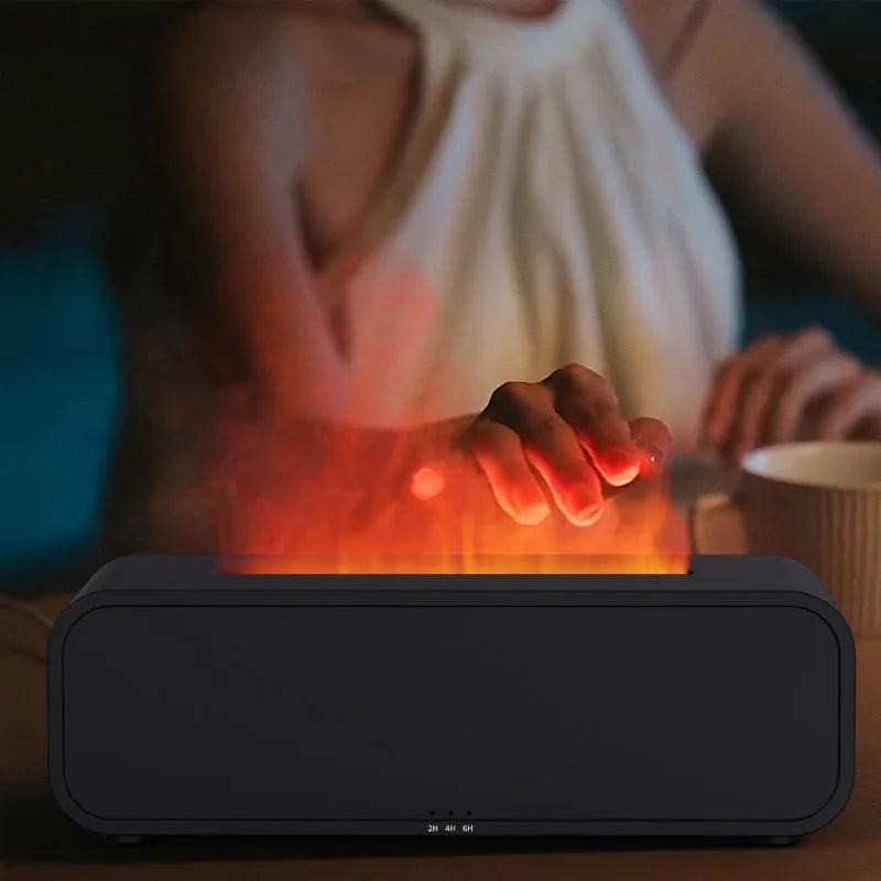 Black Flame Dynamic Aroma Diffuser with LED flame light display and remote control on a desk.