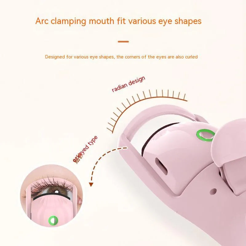 Electric eyelash curler in pink or white with silicone pad, USB cable, and three-speed temperature control.