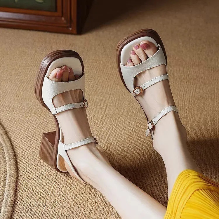 Women's beige open toe square toe retro platform sandals with a rubber sole.