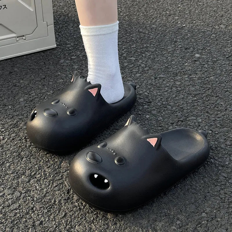 White and black women's EVA puppy slippers with toe cap sandal design showing injection moulded soles