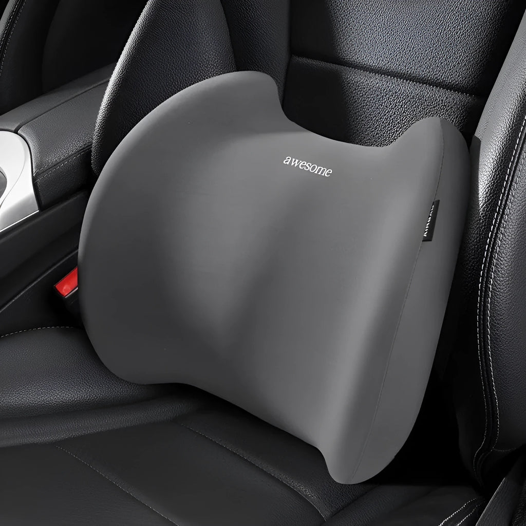 Grey geometric-patterned memory foam car headrest pillow and lumbar support pillow on a car seat.