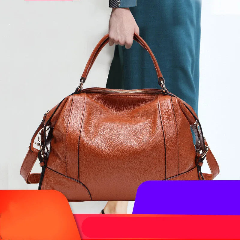 European top layer cowhide leather shoulder bag for ladies with tassel detail, zipper closure, soft handle, in black colour, medium size
