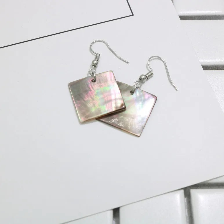 Women's natural shell earrings in geometric square and rectangular shapes with retro styling