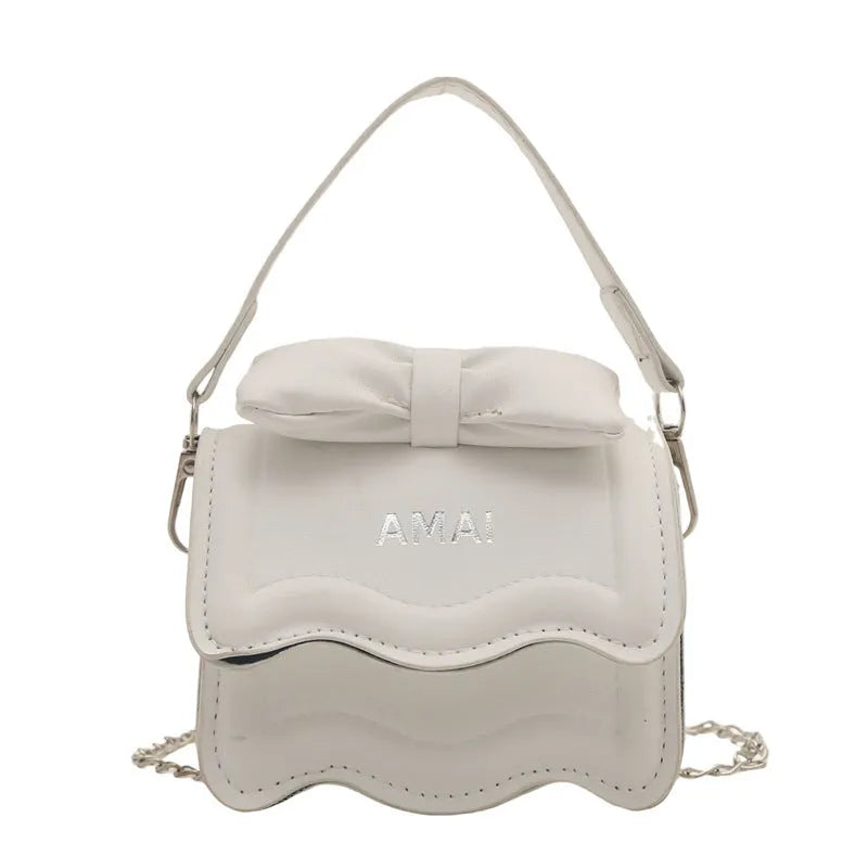 Mini crossbody bag in PU material with adjustable strap available in seven colours