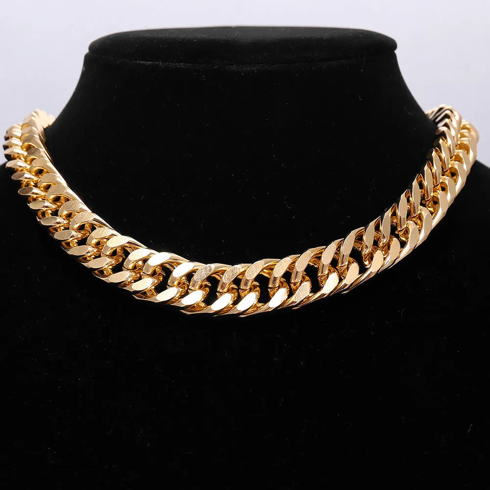 Gold thick chain women's necklace with large links, shown from the side on a plain background.