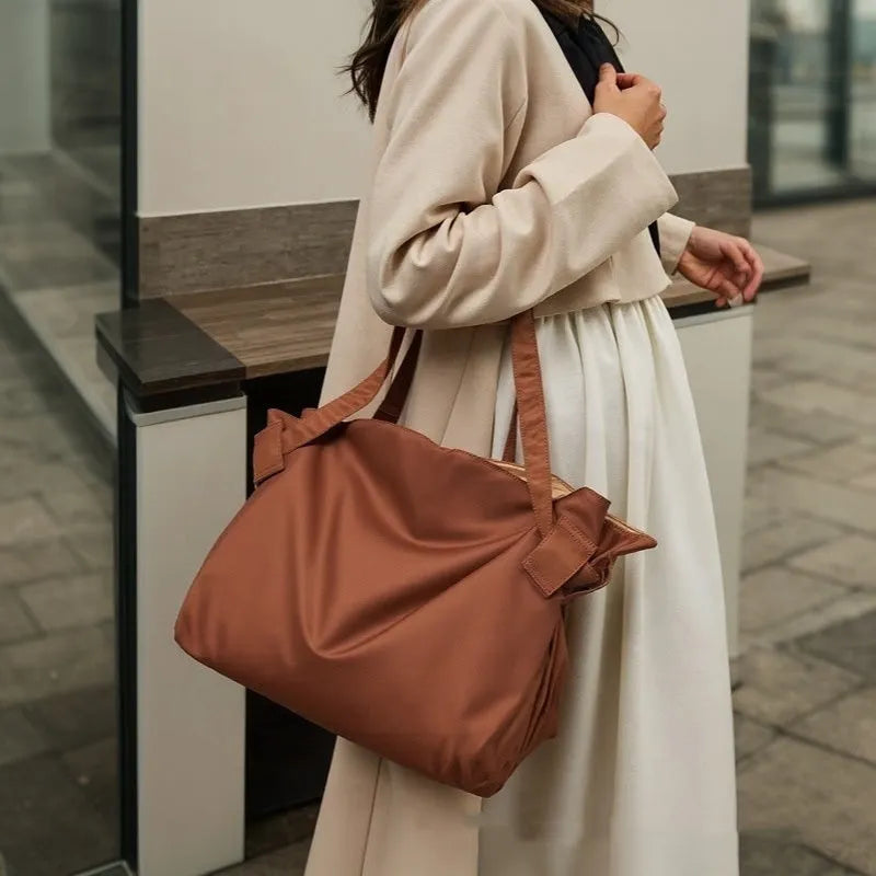 Women's Oxford cloth shoulder crossbody luggage bag in black or light brown with large capacity and expansion functionality