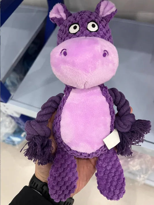 Plush animal dog toy with cotton rope core for tug of war games.