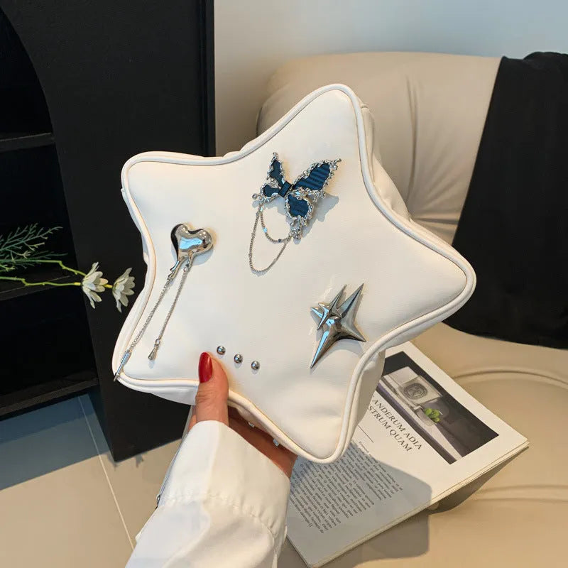 Black women's PU leather backpack with a silver metal butterfly star pendant, chain details, and an external pocket.