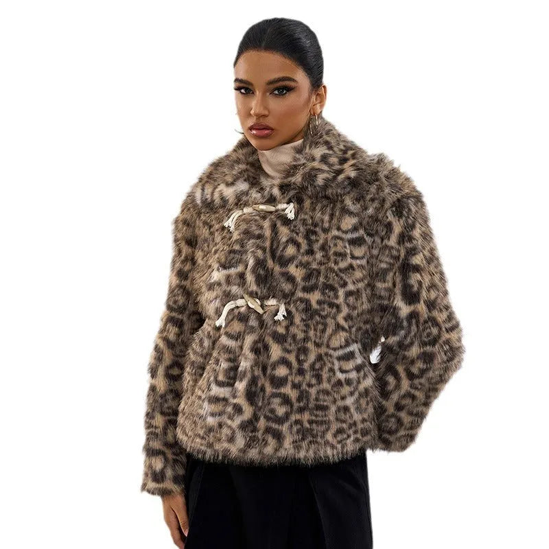 Women's leopard print coat with a buckle lapel front, shown in street fashion style