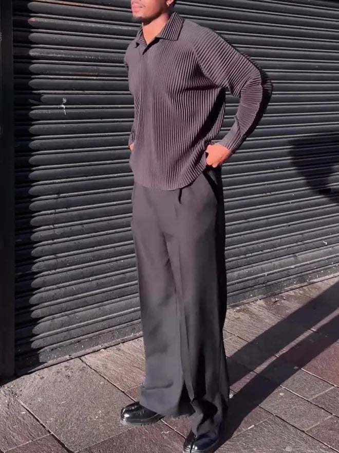 Black men's long-sleeved casual shirt with a pleated design detail on the front.