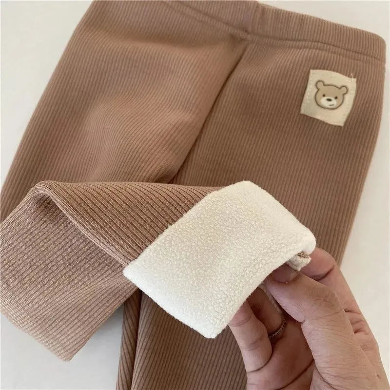 Girls' high-waist fleece-lined leggings in beige, black, brown, and grey colours on a size chart.