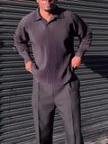 Black men's long-sleeved casual shirt with a pleated design detail on the front.