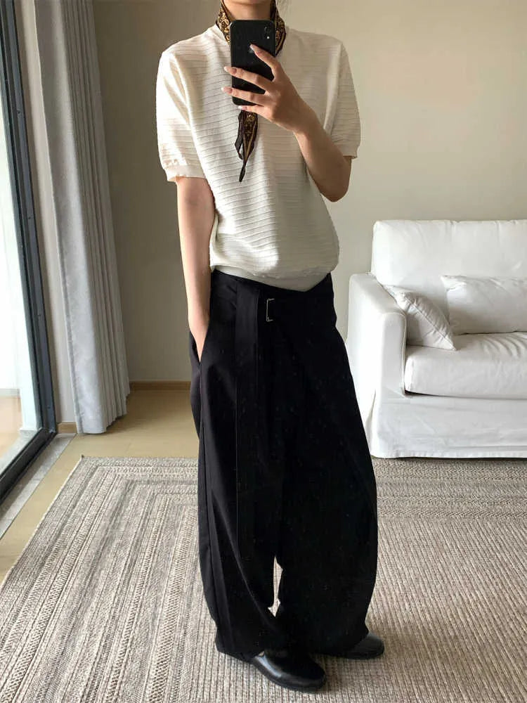 Black women's straight-leg trousers with a single pleat and adjustable waistband on a hanger.