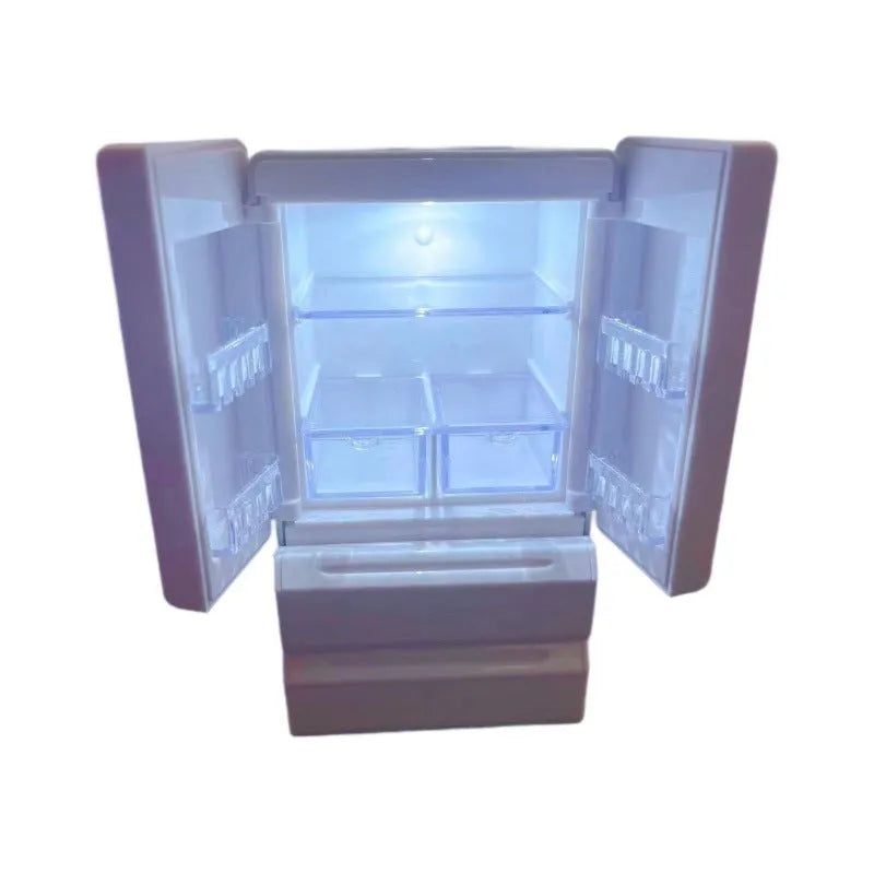 White plastic miniature candy shop model with internal light turned on, showing detailed interior.