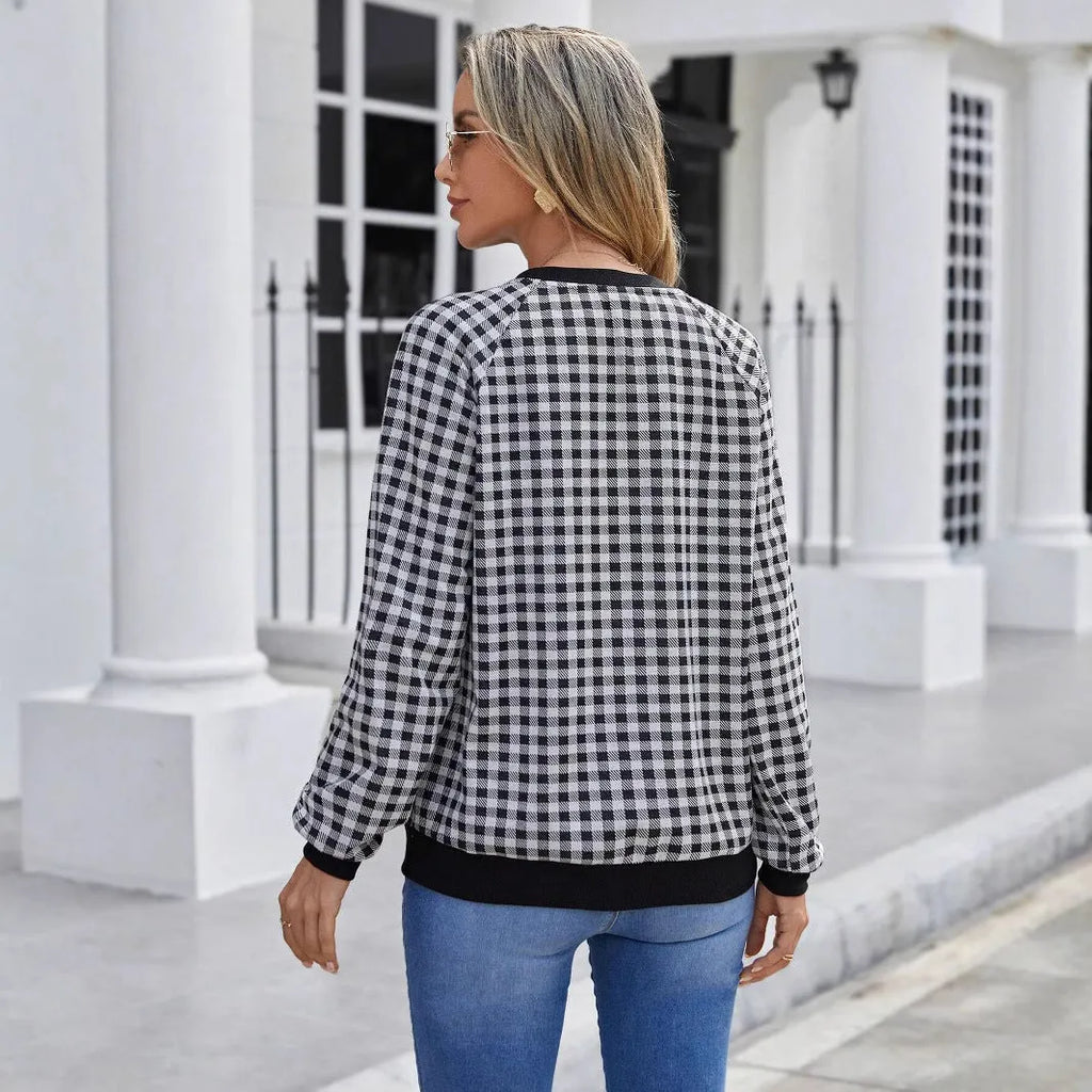 Black long sleeve polyester pullover sweater with a printed Japanese sweet plaid stripe pattern.