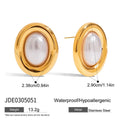 A pair of stainless steel stud earrings with a vintage pearl centre in a silver-tone finish.