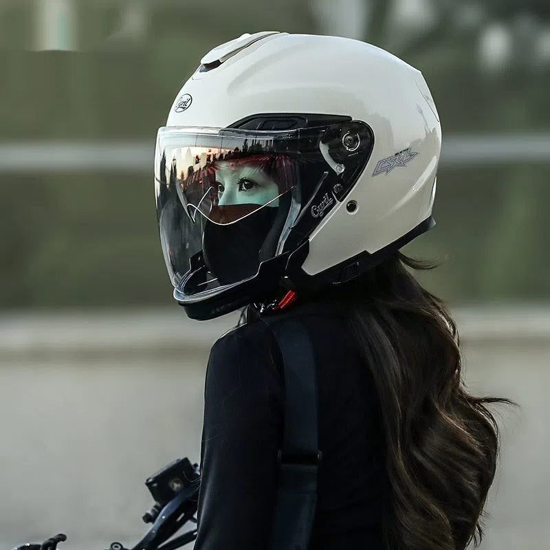 Summer motorcycle half helmet with double visor in matte black finish on light background