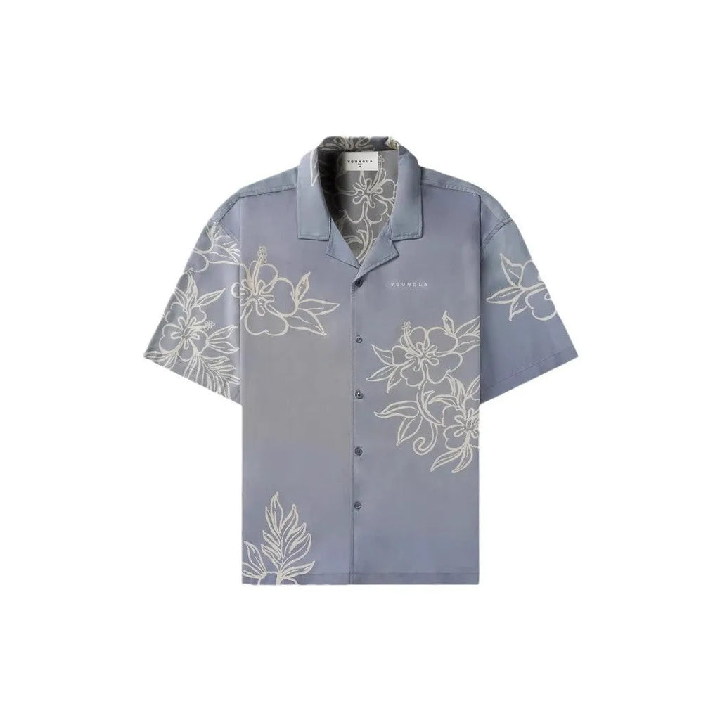 A man's loose-fitting, short-sleeve printed cardigan in a light colour for summer.
