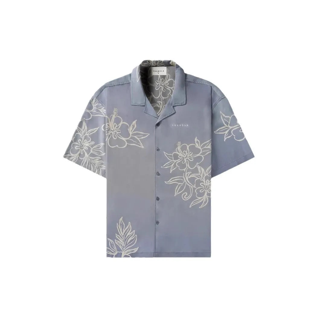 A man's loose-fitting, short-sleeve printed cardigan in a light colour for summer.