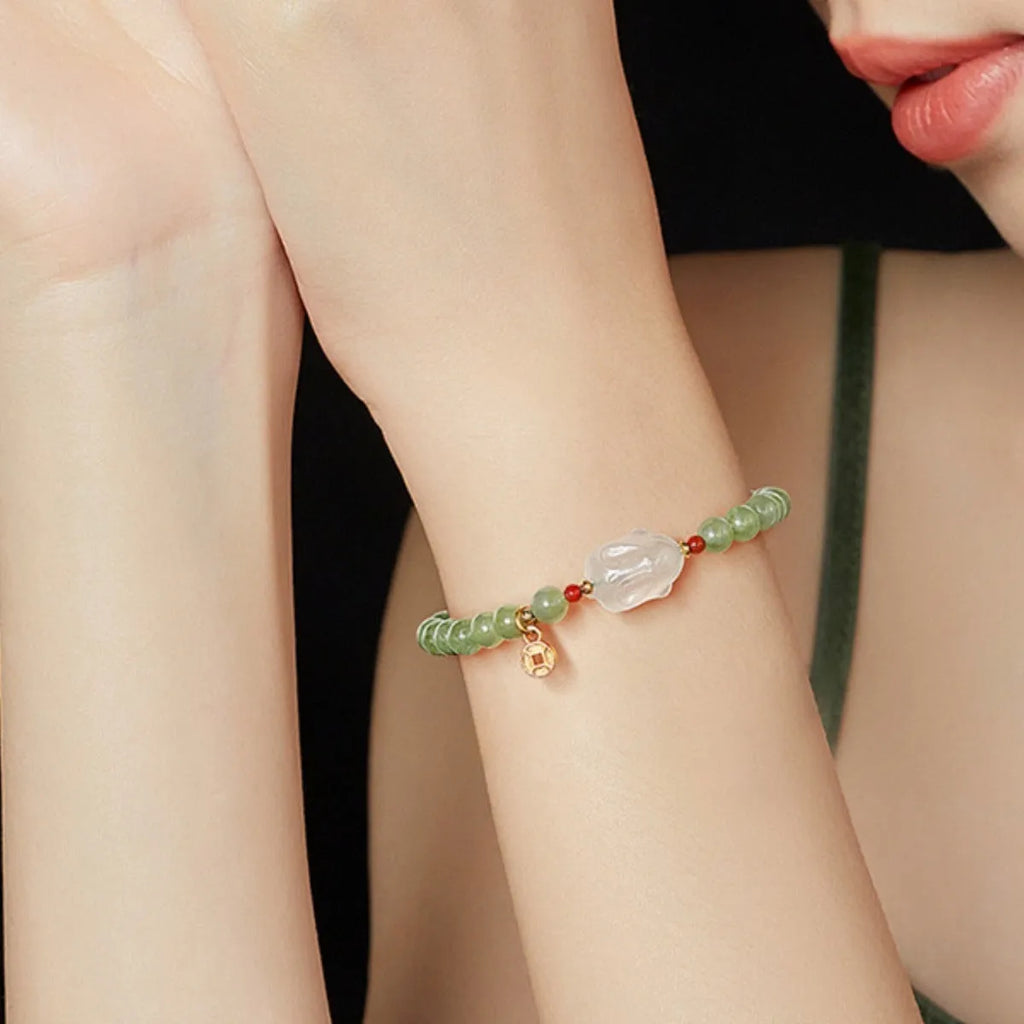 Handmade glass rabbit charm bracelet for women with coloured glaze details