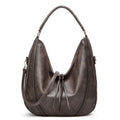 Retro large capacity PU tote shoulder bag with tassel hollow detailing and zipper closure in white