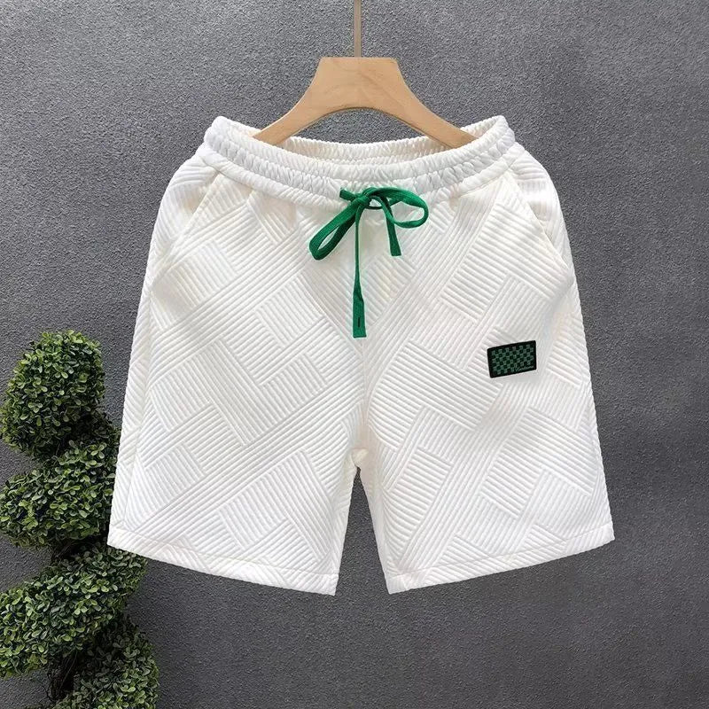 Men's elastic waist sports shorts in solid colours with micro elastic polyester fabric