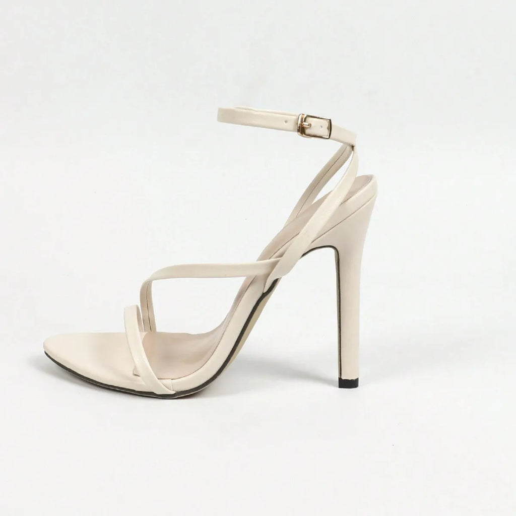 Women's gold high heels with open toe design and cross ankle straps on rubber sole