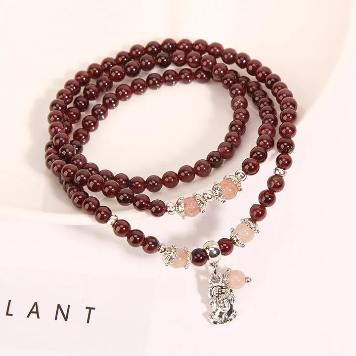 Women's floral crystal bracelet in sauteed green beans and wine red garnet colour with Bohemian and ethnic style.