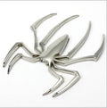 3D metal spider bumper sticker in gold on a car bumper