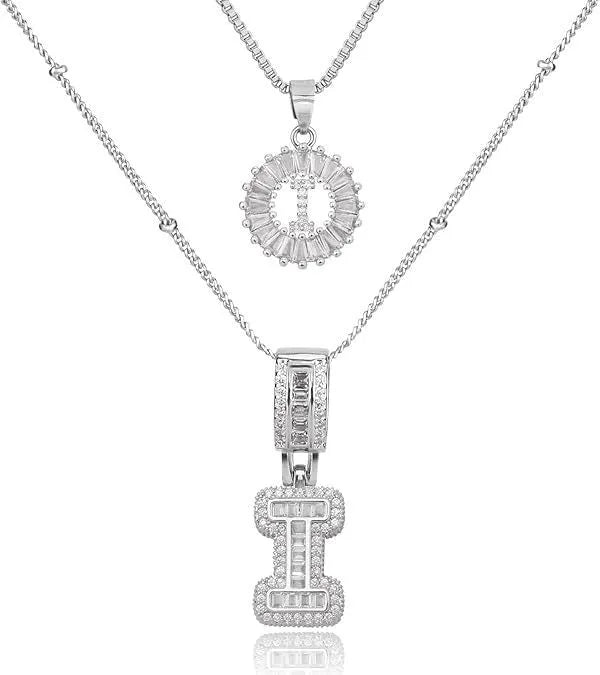 26 English letters copper-plated gold diamond initial pendant necklace with adjustable chain on display