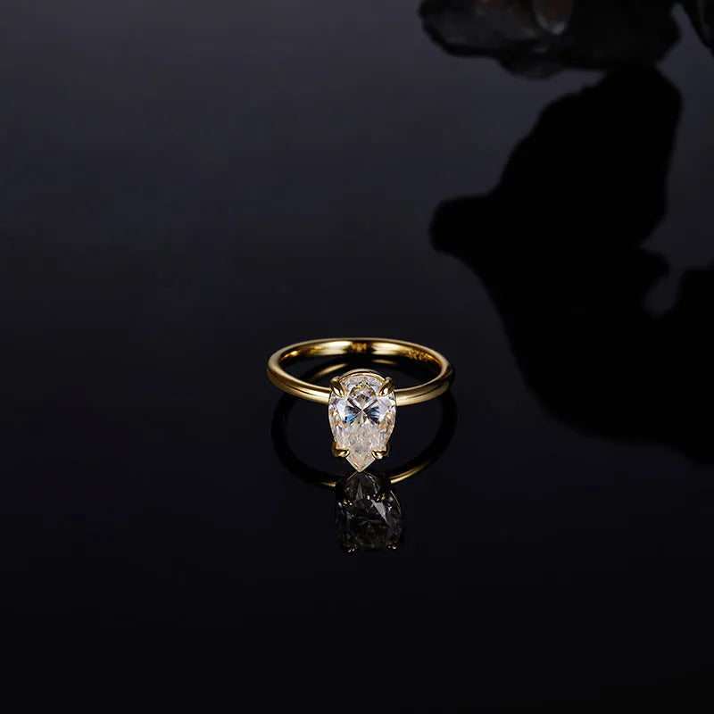 Pear-shaped moissanite ring in silver, 7x11mm stone, simple single diamond style, size 7 shown