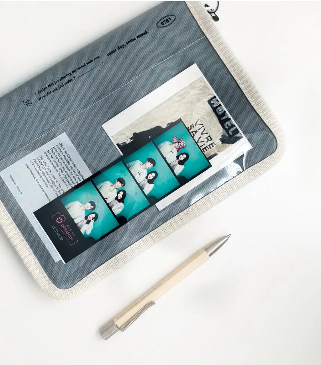 12 inch canvas tablet sleeve bag with zip opening, soft handle, clutch style, in black or white.
