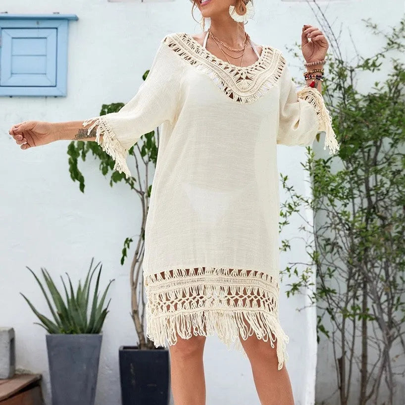 Apricot coloured crocheted patchwork women's dress with half sleeves and a mid-length skirt.