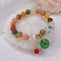 Retro Jinsi Jade bracelet with blessing card and fu character on display
